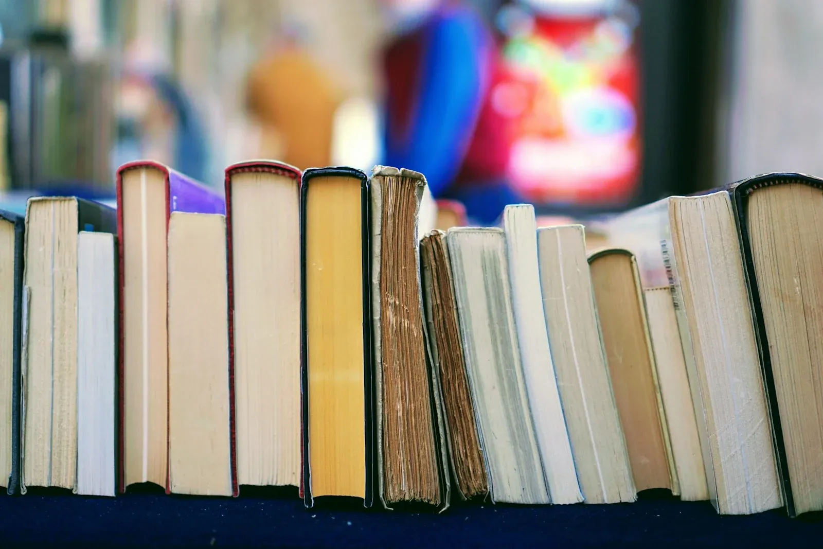 A row of books photographed at table height