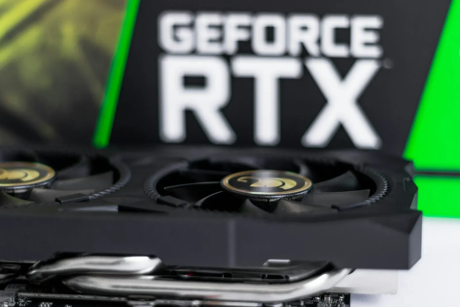 A GeForce RTX graphics card photographed on a desk
