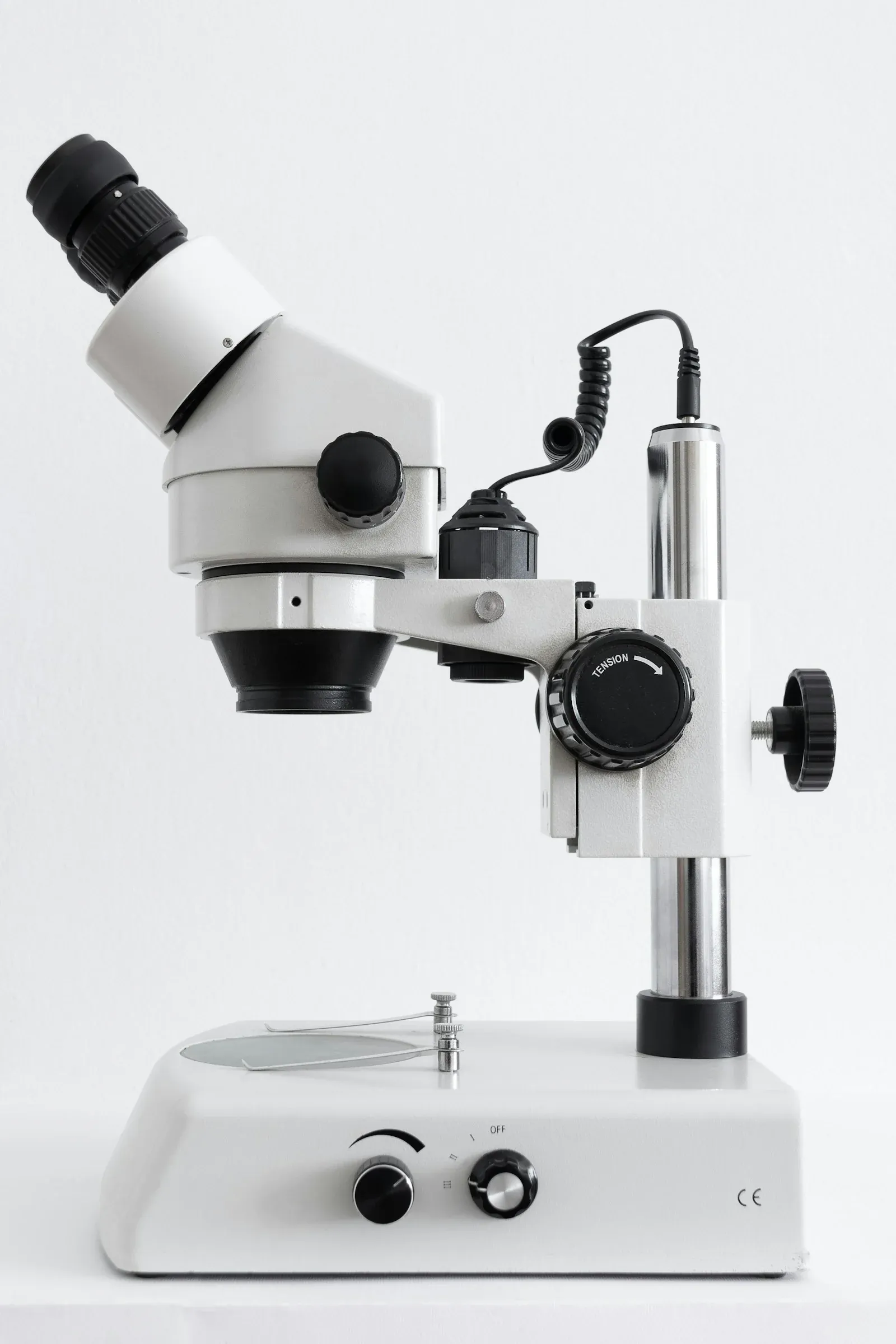 Close-up of the eyepiece and focusing controls of a laboratory microscope