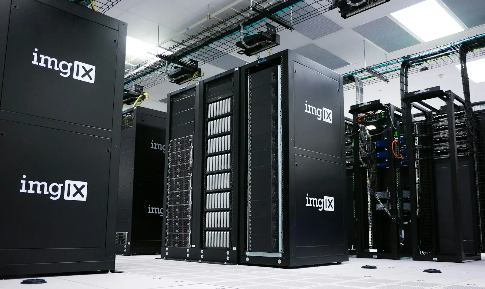 Rows of black server cabinets inside a data centre
